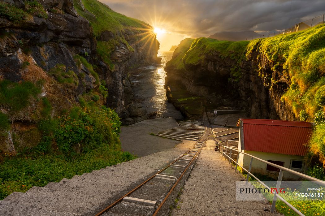 The incline railway operates a narrow-gauge line from the low-level harbour inside the gorge, up a steep incline to the boathouses of the upper village, Gjogv, Eysturoy Island, Faeroe islands, Denmark, Europe